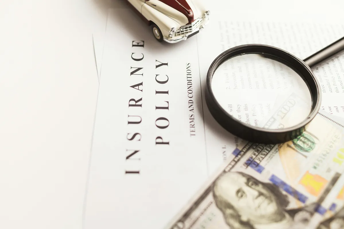 a close up of a magnifying glass on a paper with a pen and a magnifying