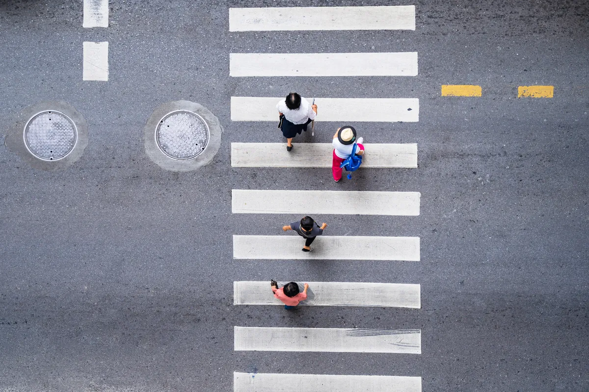 aerial view of pedestrians crossing the road