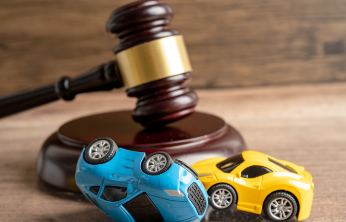 Image of two toy cars in a car accident