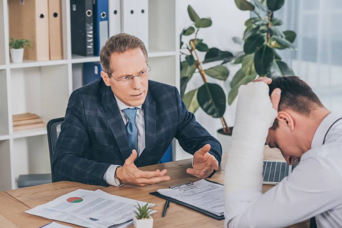 Image of a attorney talking to a injured car accident client