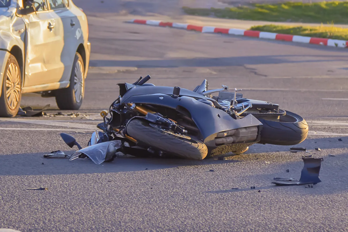 motorcycle crashed into the side of a car