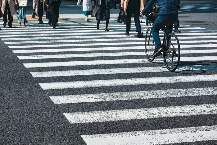 people crossing the road in a urban area