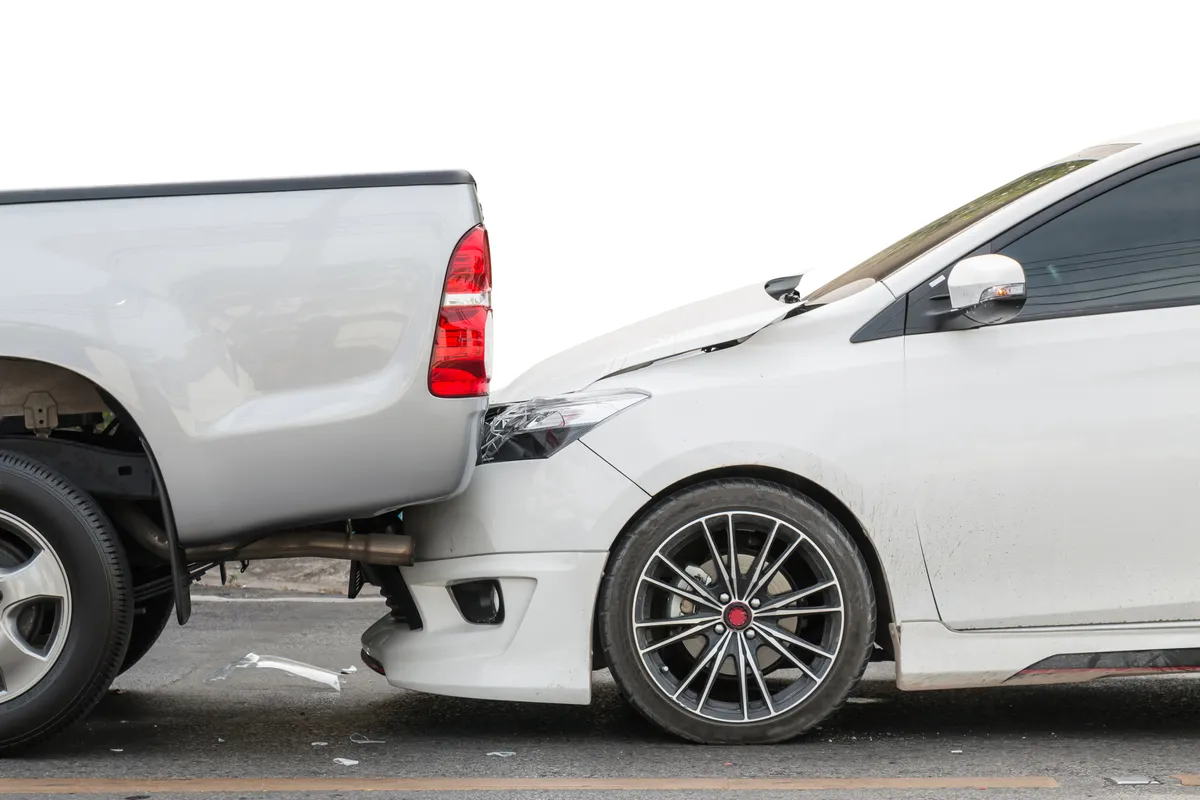 Image of sedan that rear-end a truck