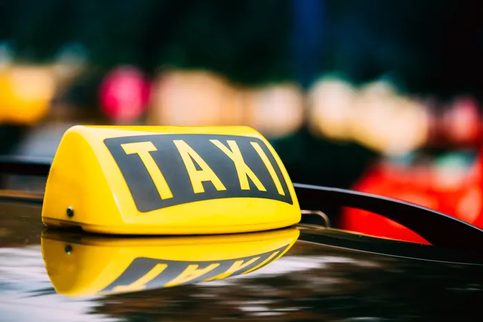 taxi sign on a roof