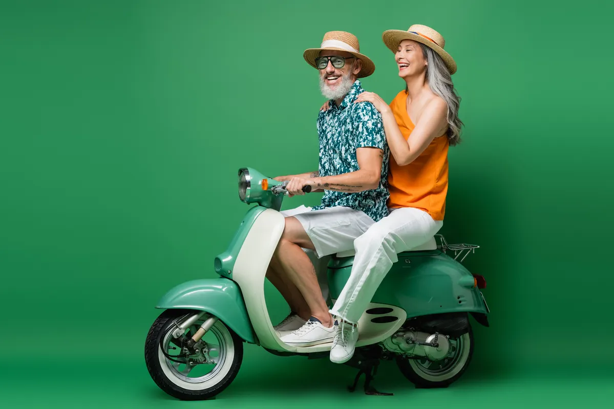 two people on a moped