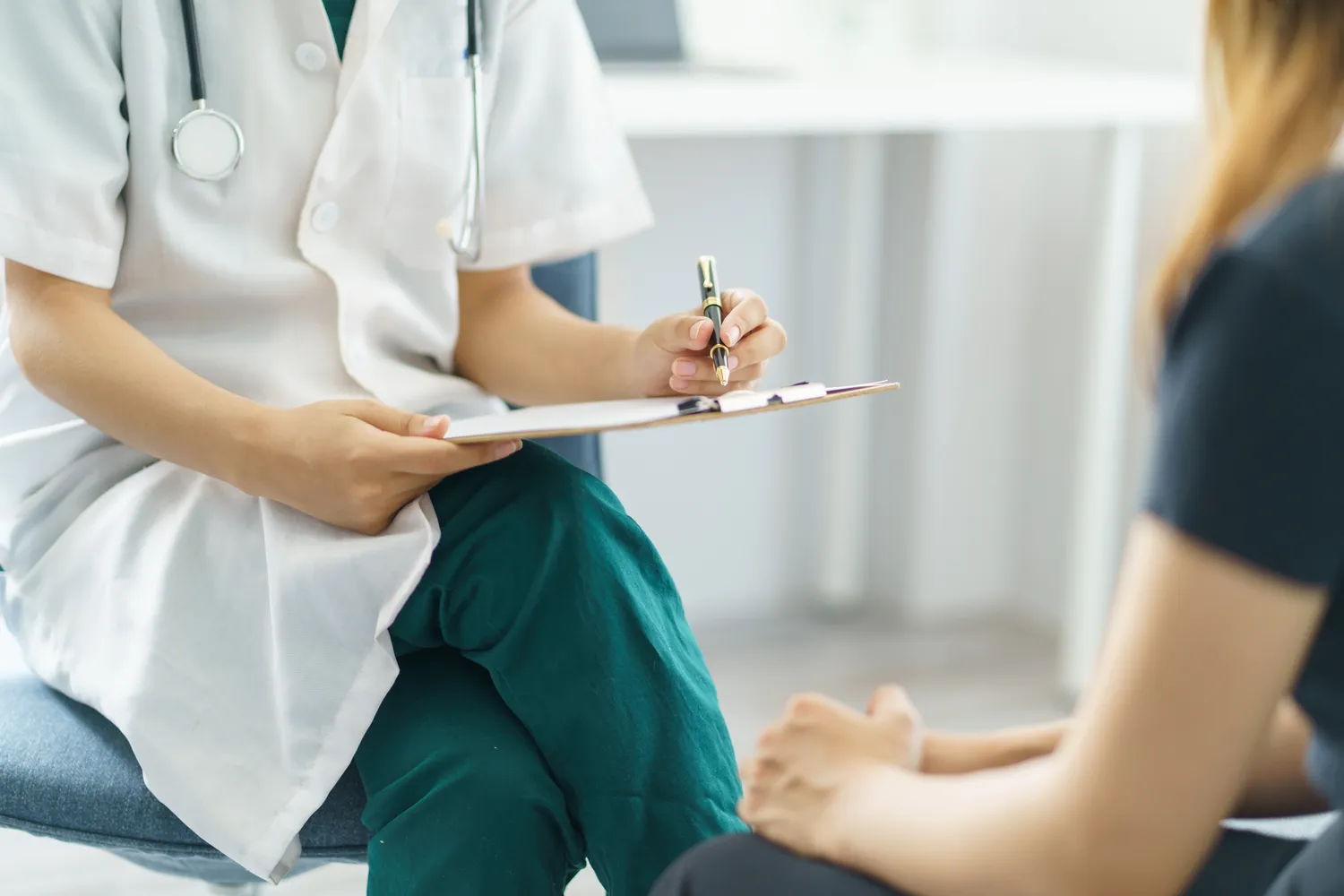 Image of a female doctor talking to a patient