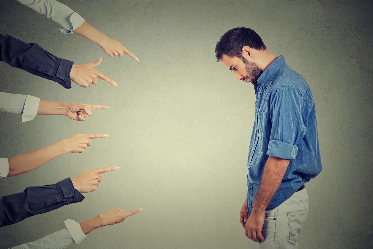 Man being pointed at to demonstrate fault