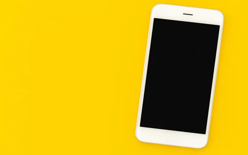 Image of phone with a yellow background